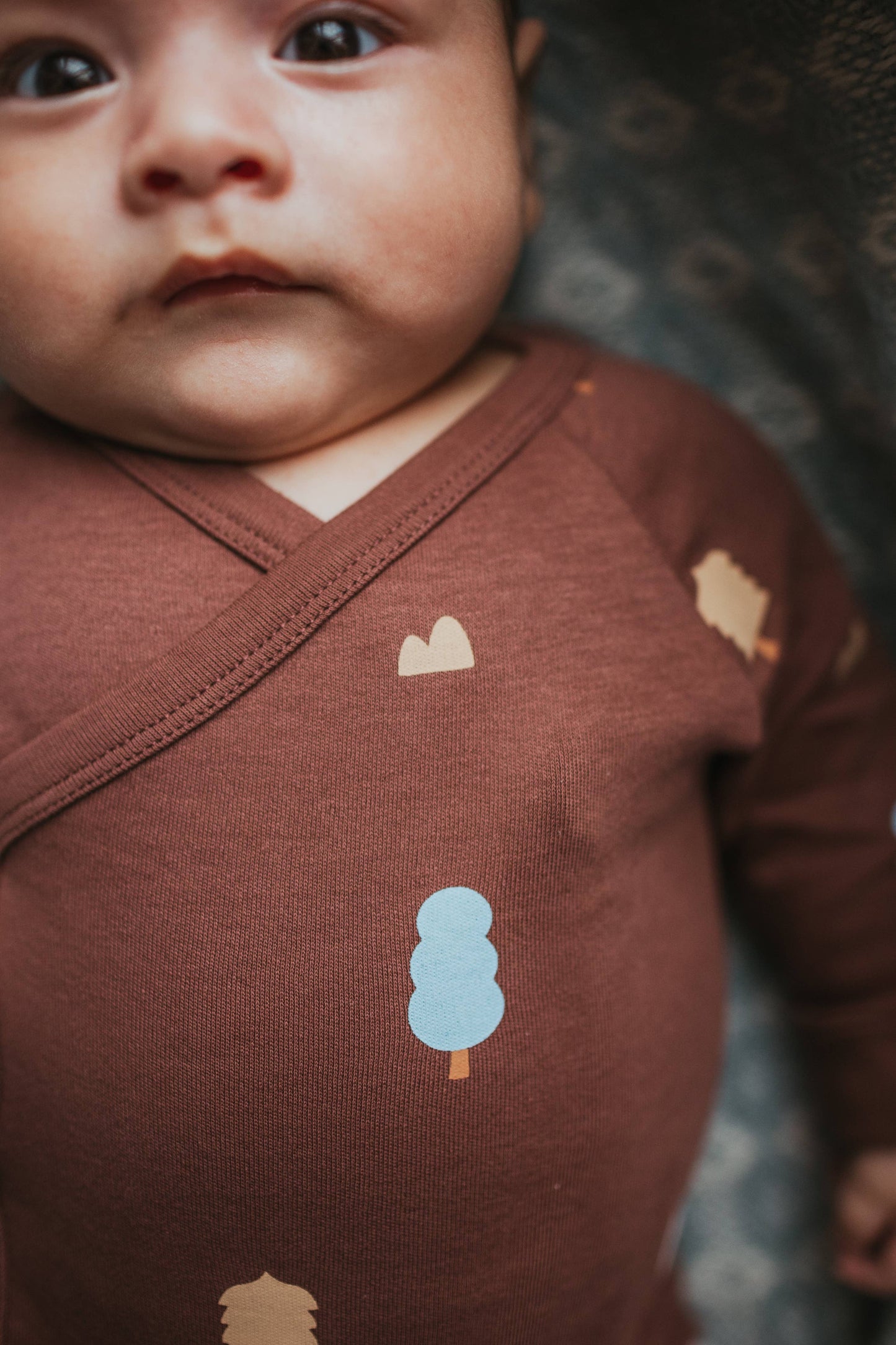 Organic Cotton Wrap Over Long Sleeve Bodysuit in Raisin